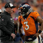 
              Denver Broncos quarterback Russell Wilson (3) talks with head coach Nathaniel Hackett during the second half of an NFL football game against the Indianapolis Colts, Thursday, Oct. 6, 2022, in Denver. (AP Photo/Jack Dempsey)
            