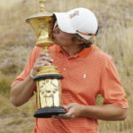 
              FILE - Peter Uihlein kisses the Havemeyer Trophy after Uihlein beat David Chung 4 and 2 in the final round of the U.S. Amateur golf tournament, Sunday, Aug. 28, 2010, at Chambers Bay in University Place, Wash. Uihlein has become the face of how quickly Saudi-funded LIV Golf can change fortunes. (AP Photo/Ted S. Warren, File)
            