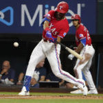 
              Texas Rangers' Leody Taveras hits a two-run home run during the fifth inning in the second baseball game of a doubleheader against the New York Yankees in Arlington, Texas, Tuesday, Oct. 4, 2022. (AP Photo/LM Otero)
            