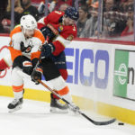 
              Philadelphia Flyers center Scott Laughton (21) and Florida Panthers defenseman Matt Kiersted (3) battle for the puck during the first period of an NHL hockey game, Wednesday, Oct. 19, 2022, in Sunrise, Fla. (AP Photo/Wilfredo Lee )
            