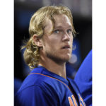 
              FILE - New York Mets pitcher Noah Syndergaard watches from the dugout after leaving the baseball game against the Arizona Diamondbacks on Friday, July 10, 2015, in New York. Syndergaard earned the moniker “Thor” for his flowing blonde locks. Astros starters Framber Valdez and Luis Garia look like naturals on the mound, but they've gotten an artificial boost from the barber shop. Both pitchers got hair extensions during this season. (AP Photo/Bill Kostroun, File)
            
