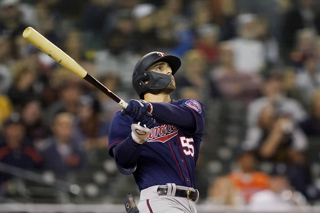 Minnesota Twins' Mark Contreras watches his solo home run during the fifth inning of a baseball gam...