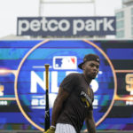 
              San Diego Padres right fielder Jose Azocar warms up during the baseball team's workout Thursday, Oct. 13, 2022, in San Diego. The Padres host the Los Angeles Dodgers for Game 3 of an NL Division Series on Friday. (AP Photo/Gregory Bull)
            