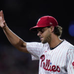 
              Philadelphia Phillies starting pitcher Aaron Nola (27) acknowledges fans after bring relieved during the seventh inning in Game 3 of baseball's National League Division Series against the Atlanta Braves, Friday, Oct. 14, 2022, in Philadelphia. (AP Photo/Matt Rourke)
            