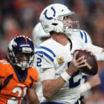 
              Indianapolis Colts quarterback Matt Ryan (2) looks to throw under pressure from Denver Broncos cornerback K'Waun Williams (21) during the second half of an NFL football game, Thursday, Oct. 6, 2022, in Denver. (AP Photo/David Zalubowski)
            