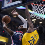 
              Washington Wizards' Will Barton (5) shoots against Indiana Pacers' Isaiah Jackson (22) during the first half of an NBA basketball game Wednesday, Oct. 19, 2022, in Indianapolis. (AP Photo/Michael Conroy)
            