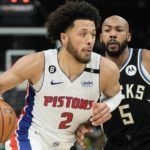
              Detroit Pistons guard Cade Cunningham (2) gets past Milwaukee Bucks guard Jevon Carter (5) during the first half of an NBA basketball game Monday, Oct. 31, 2022, in Milwaukee. (AP Photo/Morry Gash)
            