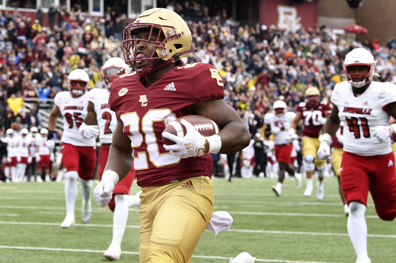Boston College running back Alex Broome runs into the endzone to score against Louisville during th...