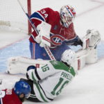 
              Montreal Canadiens goaltender Jake Allen (34) stops Dallas Stars' Joe Pavelski (16) during second-period NHL hockey game action Saturday, Oct. 22, 2022, in Montreal. (Ryan Remiorz/The Canadian Press via AP)
            