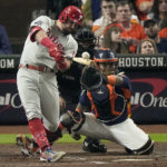 
              Philadelphia Phillies' Kyle Schwarber hits a single during the third inning in Game 2 of baseball's World Series between the Houston Astros and the Philadelphia Phillies on Saturday, Oct. 29, 2022, in Houston. (AP Photo/Sue Ogrocki)
            