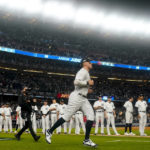 
              New York Yankees center fielder Aaron Judge (99) runs onto the field during player introductions before Game 1 of an American League Division baseball series against the Cleveland Guardians, Tuesday, Oct. 11, 2022, in New York. (AP Photo/Frank Franklin II)
            
