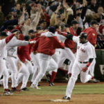 
              FILE - Boston Red Sox's David Ortiz celebrates as he rounds first base after hitting the game-winning home run in the 12th inning against the New York Yankees, during Game 4 of the AL championship series on Oct. 17, 2004, at Boston's Fenway Park. On Sunday, Oct. 23, 2022, the New York Yankees have turned to an unusual source for inspiration: the 2004 Boston Red Sox. That year, Boston became the only team in major league history to overcome a 3-0 deficit in a best-of-seven postseason series, winning four straight against the Yankees in the ALCS and going on to its first World Series title since 1918. (AP Photo/Amy Sancetta, File)
            