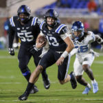 
              Duke's Riley Leonard, center, carries the ball during the first half of an NCAA college football game against North Carolina in Durham, N.C., Saturday, Oct. 15, 2022. (AP Photo/Ben McKeown)
            