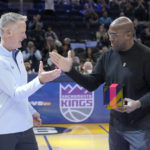 
              Golden State Warriors head coach Steve Kerr, left, shakes hands with former Warriors assistant coach and Sacramento Kings head coach Mike Brown, right, after Brown was given his 2021-2022 NBA Championship ring before an NBA basketball game between the Warriors and the Kings, Sunday, Oct. 23, 2022, in San Francisco. (AP Photo/Tony Avelar)
            