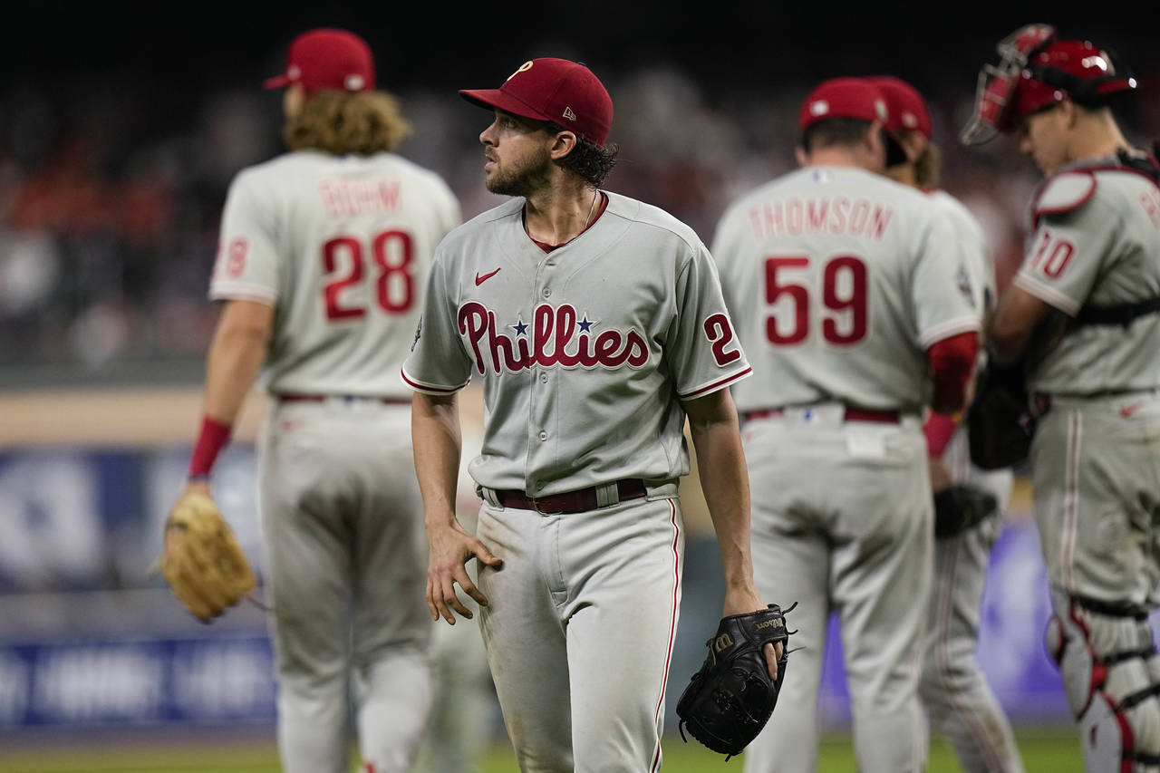 Philadelphia Phillies starting pitcher Aaron Nola leaves the game during the fifth inning in Game 1...