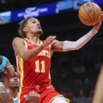 
              Atlanta Hawks guard Trae Young (11) shoots in the second half of a NBA basketball game against the Charlotte Hornets Sunday, Oct. 23, 2022 in Atlanta. (AP Photo/Brett Davis)
            
