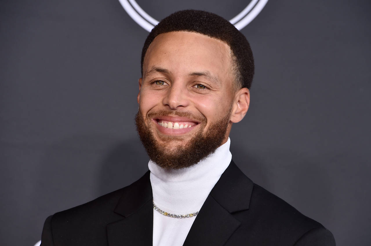 FILE - NBA basketball player Stephen Curry, of the Golden State Warriors, arrives at the ESPY Award...