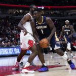 
              New Orleans Pelicans forward Zion Williamson drives against Chicago Bulls forward Patrick Williams during the second half of an NBA preseason basketball game in Chicago, Tuesday, Oct. 4, 2022. (AP Photo/Nam Y. Huh)
            
