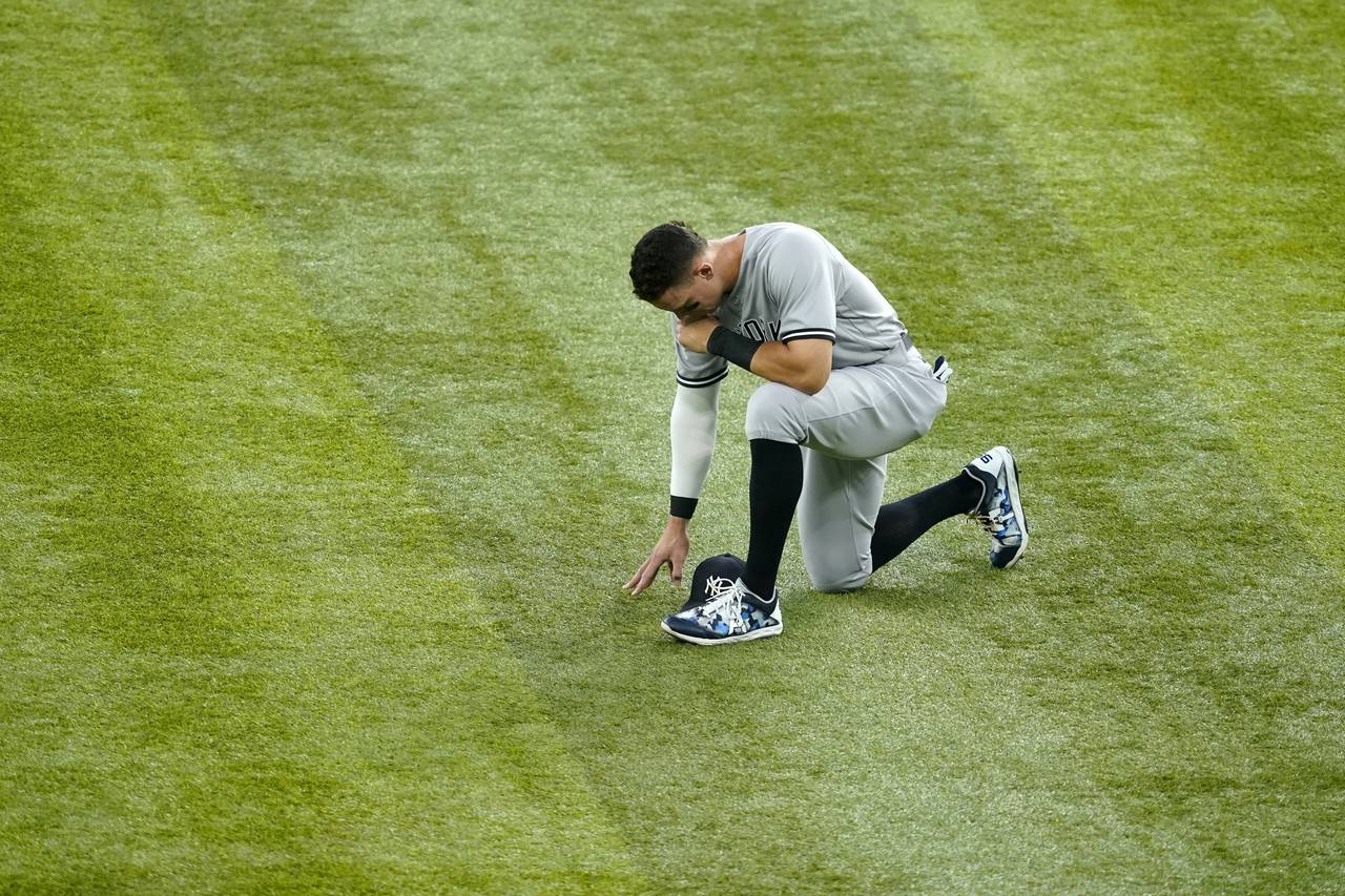 New York Yankees' Aaron Judge spends a moment by himself near centerfield before the second basebal...