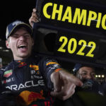 
              Red Bull driver Max Verstappen of the Netherlands celebrates with teammates as he became F1 drivers world champion, during the Japanese Formula One Grand Prix at the Suzuka Circuit in Suzuka, central Japan, Sunday, Oct. 9, 2022. (AP Photo/Toru Hanai)
            