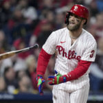 
              Philadelphia Phillies designated hitter Bryce Harper flies out during the =8 inning in Game 3 of the baseball NL Championship Series between the San Diego Padres and the Philadelphia Phillies on Friday, Oct. 21, 2022, in Philadelphia. (AP Photo/Matt Slocum)
            