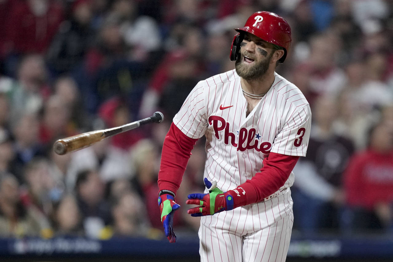 Philadelphia Phillies designated hitter Bryce Harper flies out during the =8 inning in Game 3 of th...