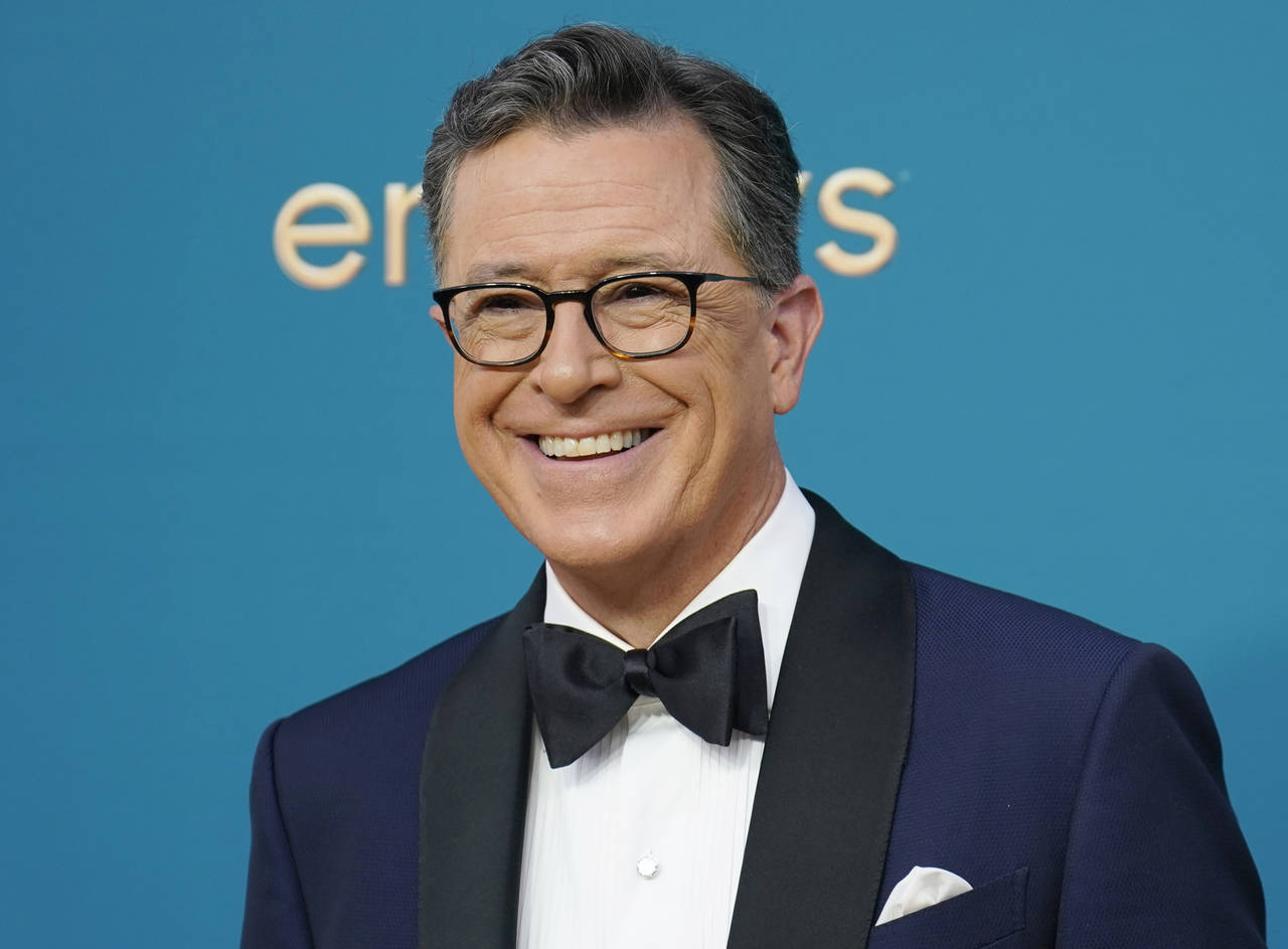 FILE - Late night talk show host Stephen Colbert arrives at the 74th Primetime Emmy Awards in Los A...
