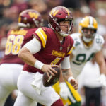 
              Washington Commanders quarterback Taylor Heinicke looks to pass during the first half of an NFL football game against the Green Bay Packers, Sunday, Oct. 23, 2022, in Landover, Md. (AP Photo/Patrick Semansky)
            