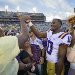 
              LSU wide receiver Jaray Jenkins (10) celebrates with fans who came onto the field after LSU defeated Mississippi in an NCAA college football game in Baton Rouge, La., Saturday, Oct. 22, 2022. (AP Photo/Matthew Hinton)
            