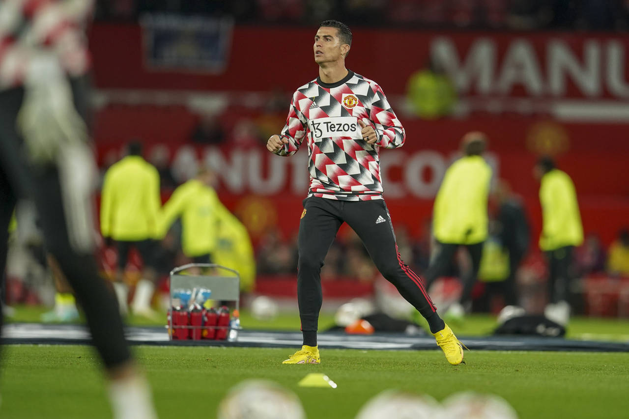 Manchester United's Cristiano Ronaldo warms up ahead of the English Premier League soccer match bet...