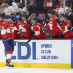 
              Florida Panthers center Aleksander Barkov is congratulated by teammates after he scored during the first period of an NHL hockey game against the Ottawa Senators, Saturday, Oct. 29, 2022, in Sunrise, Fla. (AP Photo/Wilfredo Lee)
            