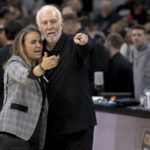 
              San Antonio Spurs head coach Gregg Popovich embraces former assistant coach Becky Hammon during the first half of an NBA basketball game against the Chicago Bulls, Friday, Oct. 28, 2022, in San Antonio. (AP Photo/Nick Wagner)
            