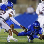 
              Mississippi State safety Collin Duncan (19) forces a fumble by Kentucky wide receiver Rahsaan Lewis (19) during the first half of an NCAA college football game in Lexington, Ky., Saturday, Oct. 15, 2022. (AP Photo/Michael Clubb)
            