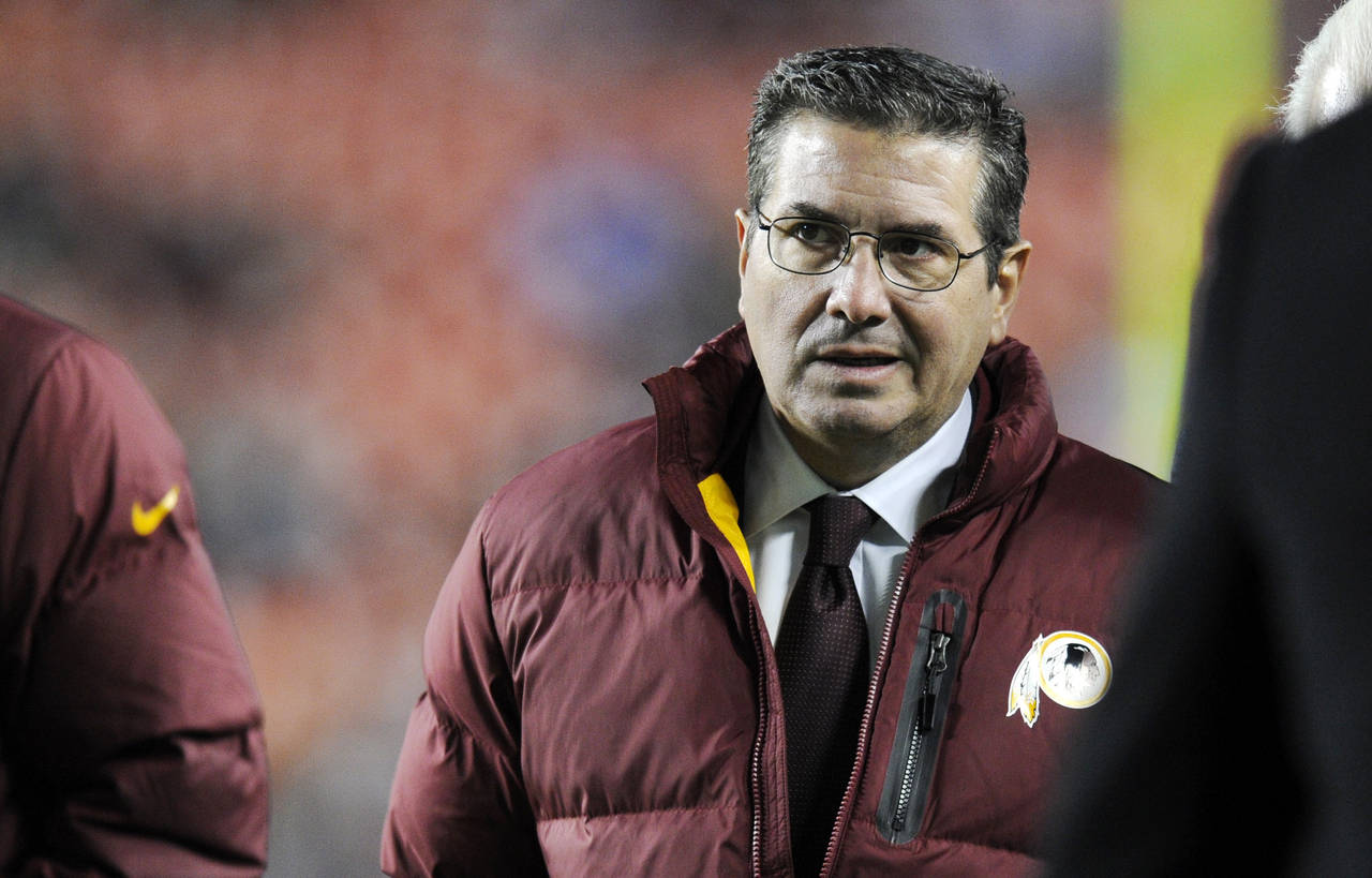 FILE - In this Dec. 1, 2013, file photo, Washington Redskins owner Dan Snyder walks off the field b...