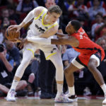 
              Utah Jazz forward Lauri Markkanen, left, protects the ball as Houston Rockets forward Jabari Smith Jr., right, reaches in during the first half of an NBA basketball game, Monday, Oct. 24, 2022, in Houston. (AP Photo/Michael Wyke)
            