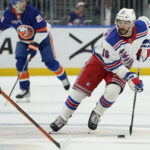 
              New York Rangers center Vincent Trocheck (16) looks to pass the puck in the first period of an NHL hockey game against the New York Islanders, Wednesday, Oct. 26, 2022, in Elmont, N.Y. (AP Photo/John Minchillo)
            