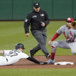 
              St. Louis Cardinals second baseman Brendan Donovan, right, awaits the pickoff attempt from starting pitcher Jose Quintana as Pittsburgh Pirates' Kevin Newman (27) dives back to second during the first inning of a baseball game, Monday, Oct. 3, 2022, in Pittsburgh. Newman was safe. (AP Photo/Keith Srakocic)
            