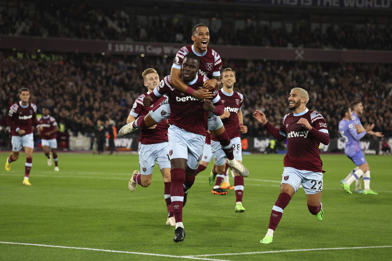 West Ham's Kurt Zouma, center, celebrates with teammates after scoring his sides first goal during ...