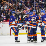 
              New York Islanders players celebrate after a goal scored by teammate Brock Nelson against the Colorado Avalanche during the third period of an NHL hockey game, Saturday, Oct. 29, 2022, in Elmont, N.Y. (AP Photo/Eduardo Munoz Alvarez)
            