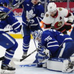 
              Ottawa Senators' Claude Giroux (28) scores on Toronto Maple Leafs goaltender Ilya Samsonov (35) during the third period of an NHL hockey game Saturday, Oct. 15, 2022, in Toronto. (Frank Gunn/The Canadian Press via AP)
            