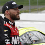 
              Ross Chastain watches cars during practice for the NASCAR auto race at Martinsville Speedway, Saturday, Oct. 29, 2022, in Martinsville, Va. (AP Photo/Chuck Burton)
            