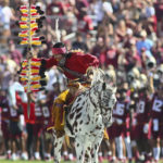 
              Chief Osceola, aboard Renegade, plants the spear in the first half of an NCAA college football game between Florida State and Wake Forest, Saturday, Oct. 1, 2022, in Tallahassee, Fla. (AP Photo/Phil Sears)
            