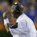 
              FILE - East Carolina coach Ruffin McNeill motions to his players during the second half of the team's NCAA college football game against Florida, Sept. 12, 2015, in Gainesville, Fla. Schools throughout the Atlantic Coast Conference and college football have hired more staffers working in roles such as analyst, quality-control coordinator or special assistant to handle the ever-rising duties of running a power-conference program. McNeill is working as a special assistant to North Carolina State head coach Dave Doeren. (AP Photo/John Raoux, File)
            