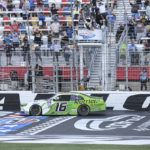 
              AJ Allmendinger (16) takes the checkered flag to win the NASCAR Xfinity auto race at Charlotte Motor Speedway on Saturday, Oct. 8, 2022, in Concord, N.C. (AP Photo/Matt Kelley)
            