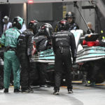 
              Mechanics change the front wing on Mercedes driver Lewis Hamilton of Britain's car during the Singapore Formula One Grand Prix, at the Marina Bay City Circuit in Singapore, Sunday, Oct. 2, 2022. (Mohd Rasfan/Pool photo via AP)
            