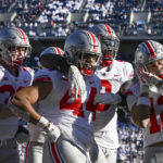 
              Ohio State defensive end J.T. Tuimoloau (44) celebrates with his teammates Jack Sawyer (33), Zach Harrison (9) and Lathan Ransom (12) after returning an interception for a touchdown during the fourth quarter of an NCAA college football game against Penn State, Saturday, Oct. 29, 2022, in State College, Pa. (AP Photo/Barry Reeger)
            