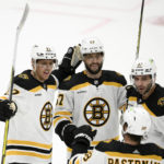 
              Boston Bruins defenseman Hampus Lindholm (27) celebrates his goal with right wing David Pastrnak (88), defenseman Jakub Zboril (67) and center Patrice Bergeron (37) during the third period of the team's NHL hockey game against the Washington Capitals, Wednesday, Oct. 12, 2022, in Washington. The Bruins won 5-2. (AP Photo/Nick Wass)
            