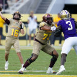
              Arizona State quarterback Trenton Bourguet (16) throws a pass as offensive lineman Isaia Glass (73) blocks Washington defensive lineman Jeremiah Martin (3) during the second half of an NCAA college football game in Tempe, Ariz., Saturday, Oct. 8, 2022. (AP Photo/Ross D. Franklin)
            