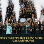 
              Los Angeles FC players celebrate with the Supporters' Shield trophy after an MLS soccer match against the Nashville SC, Sunday Oct. 9, 2022, in Los Angeles. The Supporters' Shield is awarded to the MLS team with the best regular-season record. (AP Photo/Ringo H.W. Chiu)
            