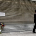 
              A bouquet of flowers is placed at the shopping center the day after five people were stabbed and one was killed after a man grabbed a knife from a supermarket shelf in Assago, on the outskirts of Milan, Italy, Friday Oct. 28, 2022. Police on Thursday arrested a 46-year-old Italian man suspected in the attack at a shopping center in the Milan suburb of Assago. (Claudio Furlan/LaPresse via AP)
            